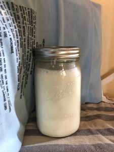 wrap heating pad around jar of milk