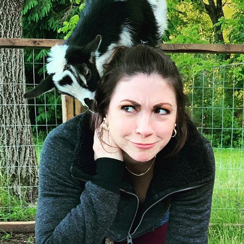 Goat Yoga with goat on back